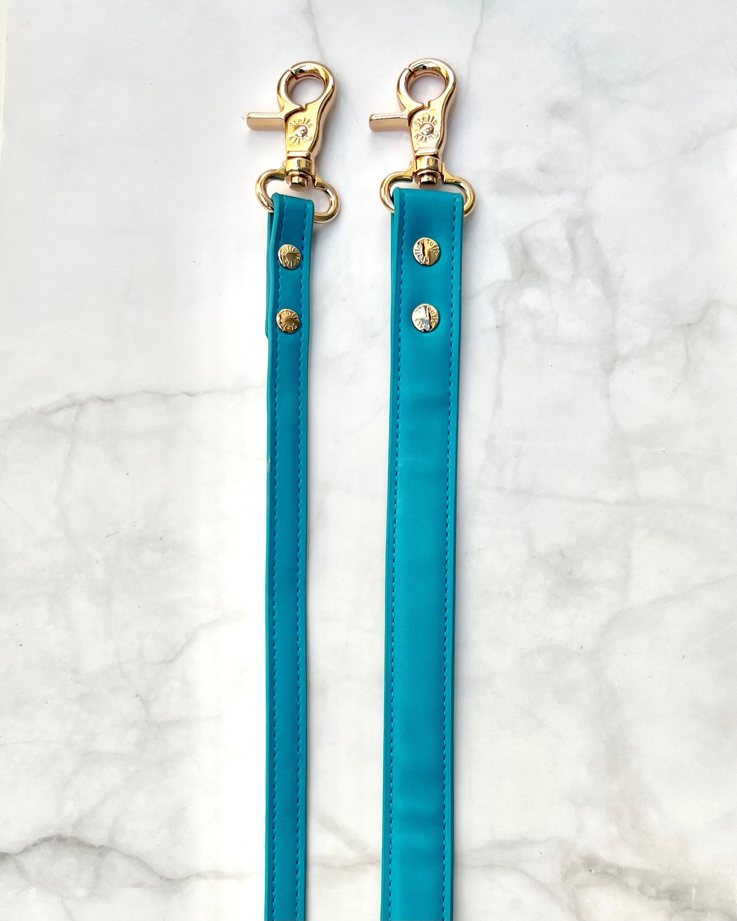 Coastal blue vegan leather dog collar close-up showing brass hardware and stitching